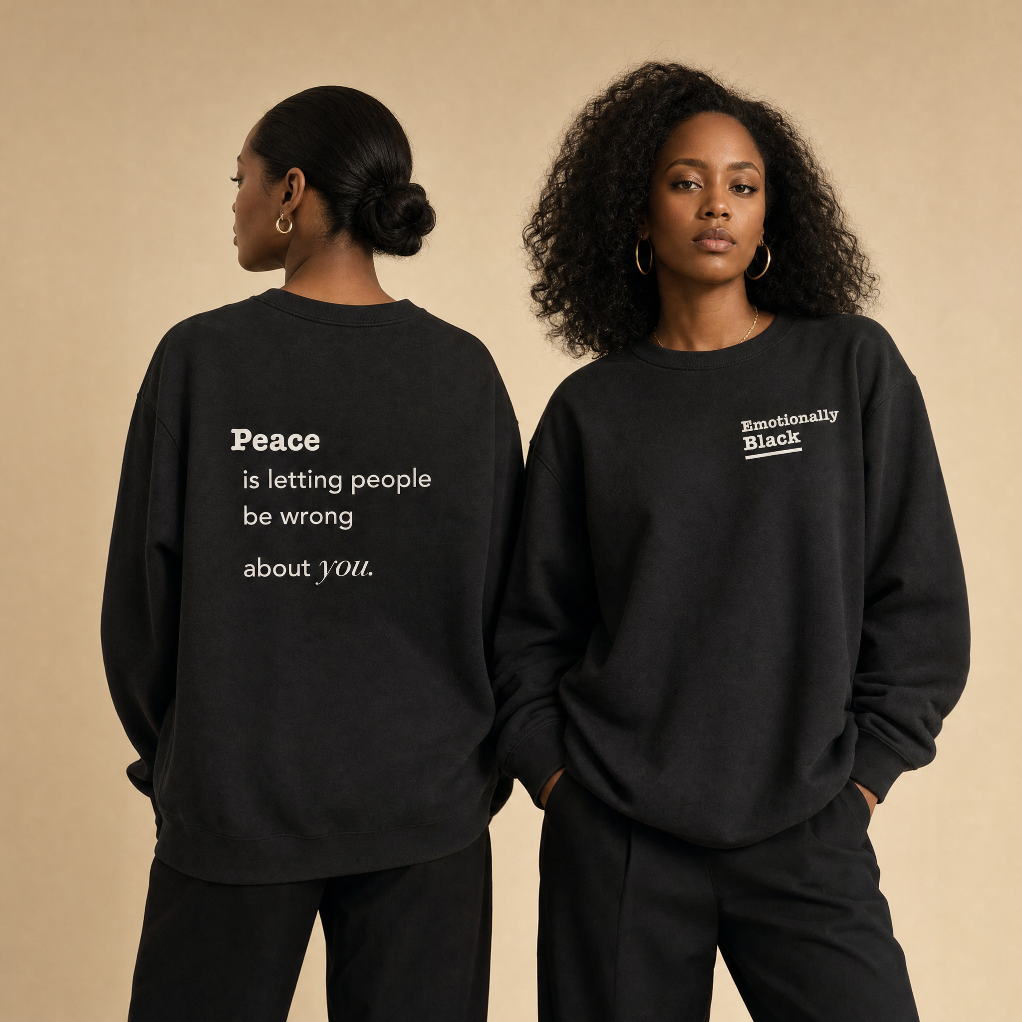 Two Black models wearing Blackety Black Peace crewnecks — cream-ink back print visible