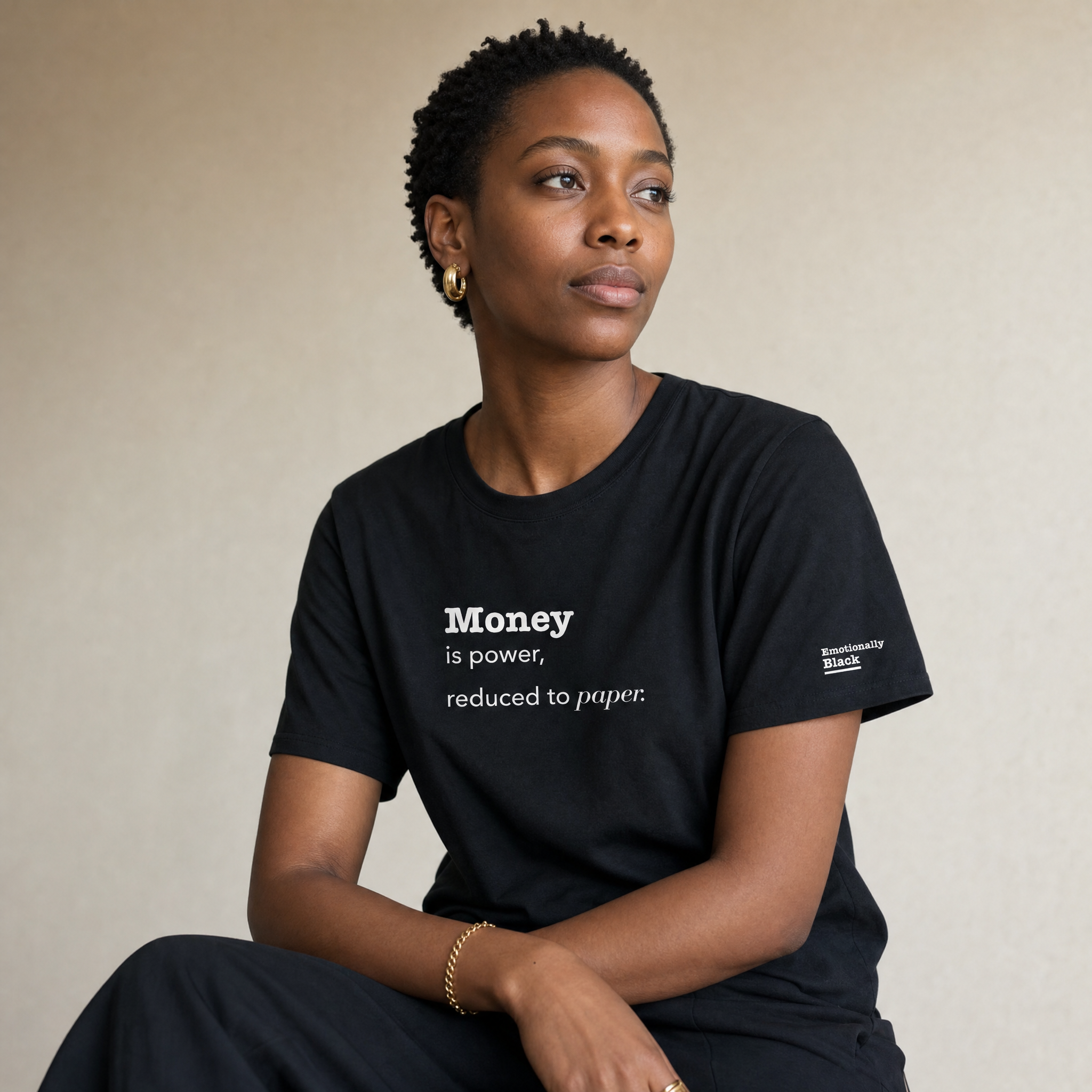 Black woman in the Blackety Black Money Is Power ladies slim-fit tee — cream-ink statement print