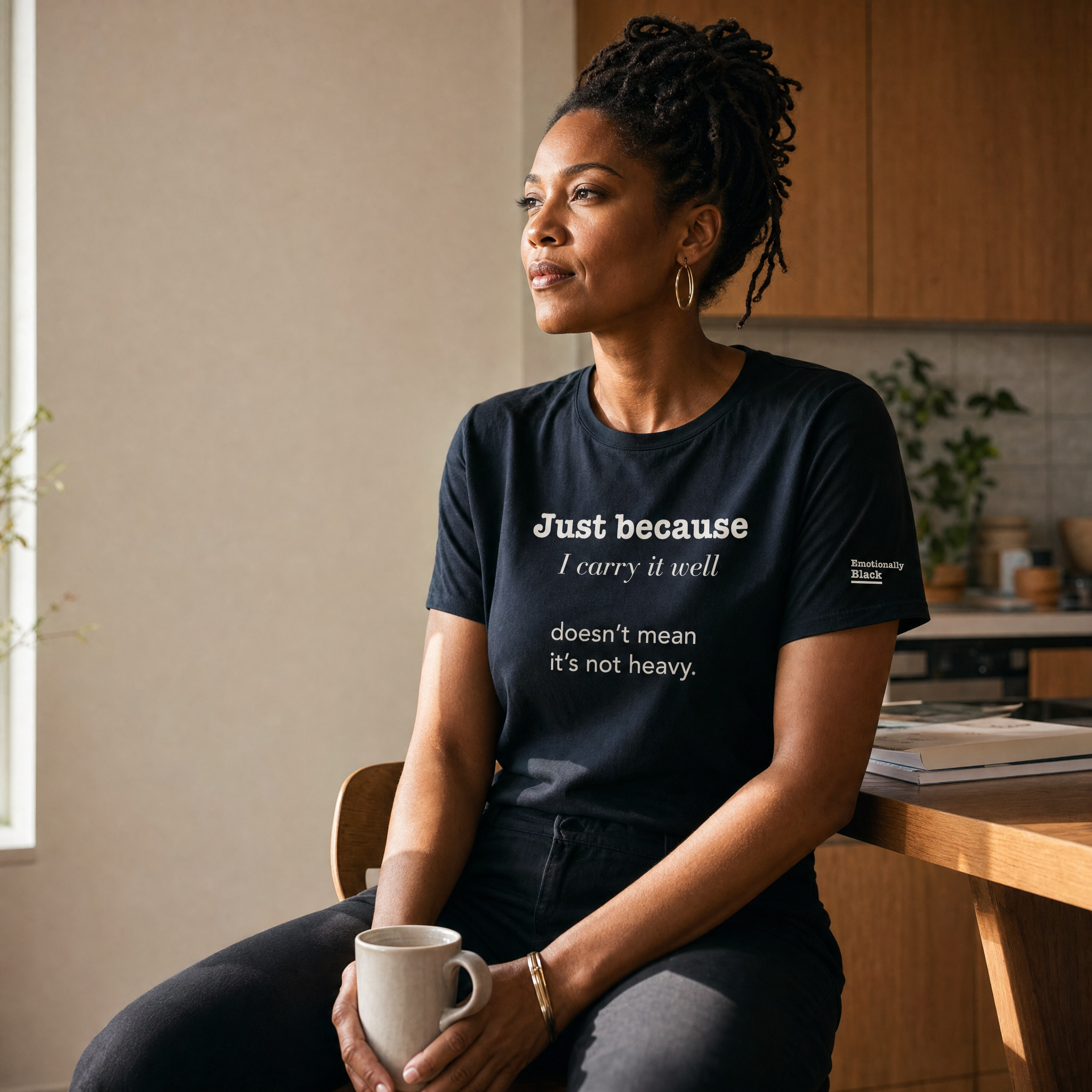 Black woman in the Blackety Black Just Because I Carry It Well ladies slim-fit tee — cream-ink statement print