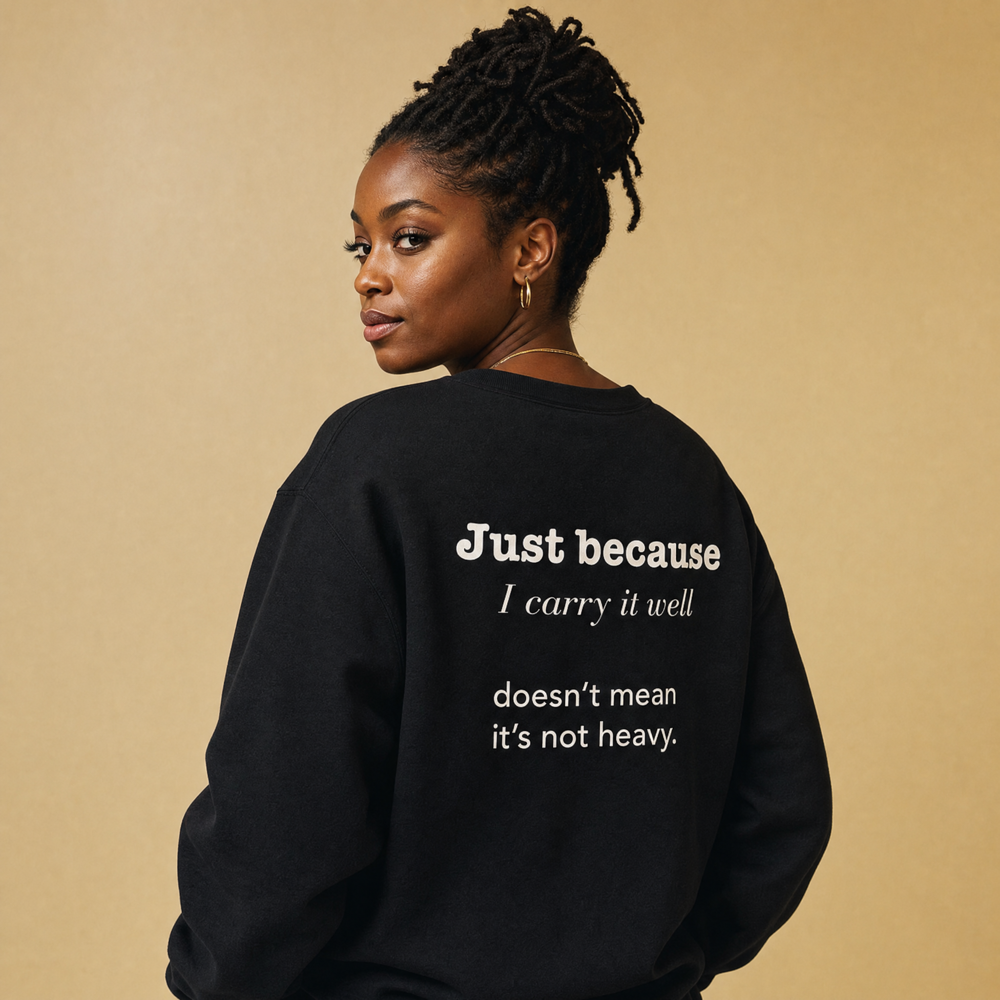Black model in the Blackety Black Just Because I Carry It Well crewneck — Emotionally Black left chest in cream