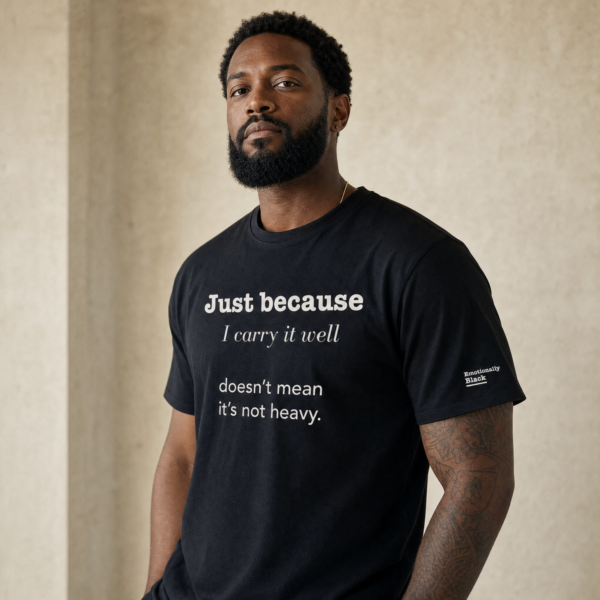 Black model in the Blackety Black Just Because I Carry It Well tee — cream-ink statement print