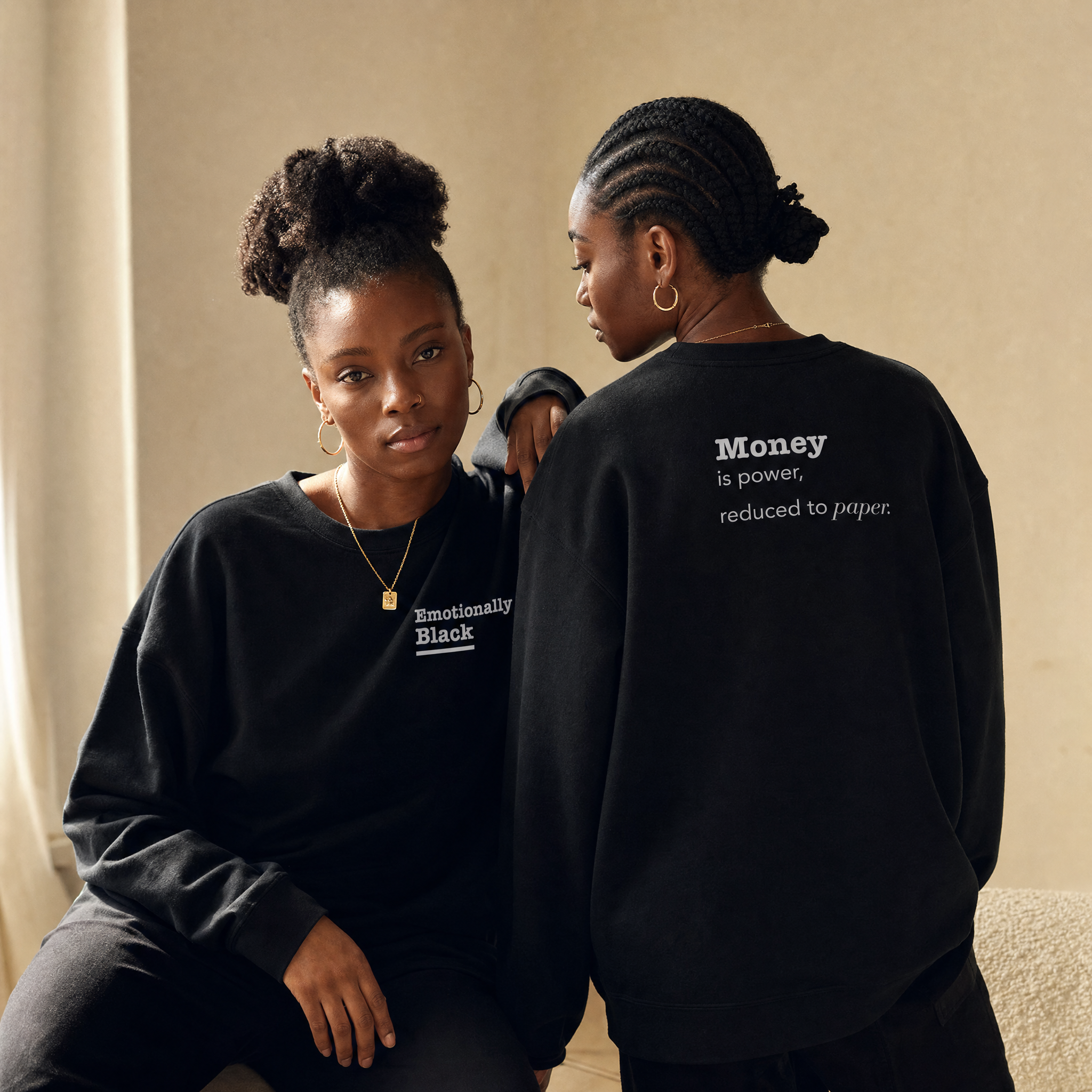 Black model in the Blackety Black Money Is Power crewneck — cream-ink back print on premium black sweatshirt