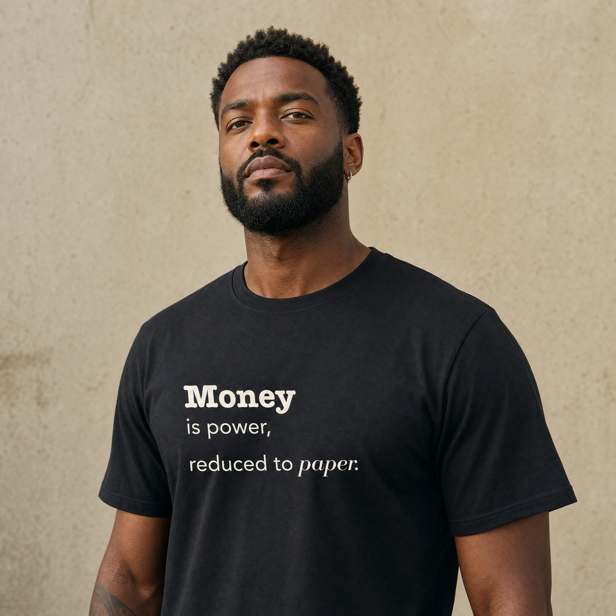 Black model in the Blackety Black Money Is Power tee — cream-ink statement print on heavyweight black cotton